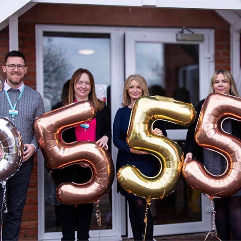 The team at Allanbank Care Home in Dumfries celebrate getting a 'Very Good' Care Inspectorate rating - pictured outside the home with their very good balloons