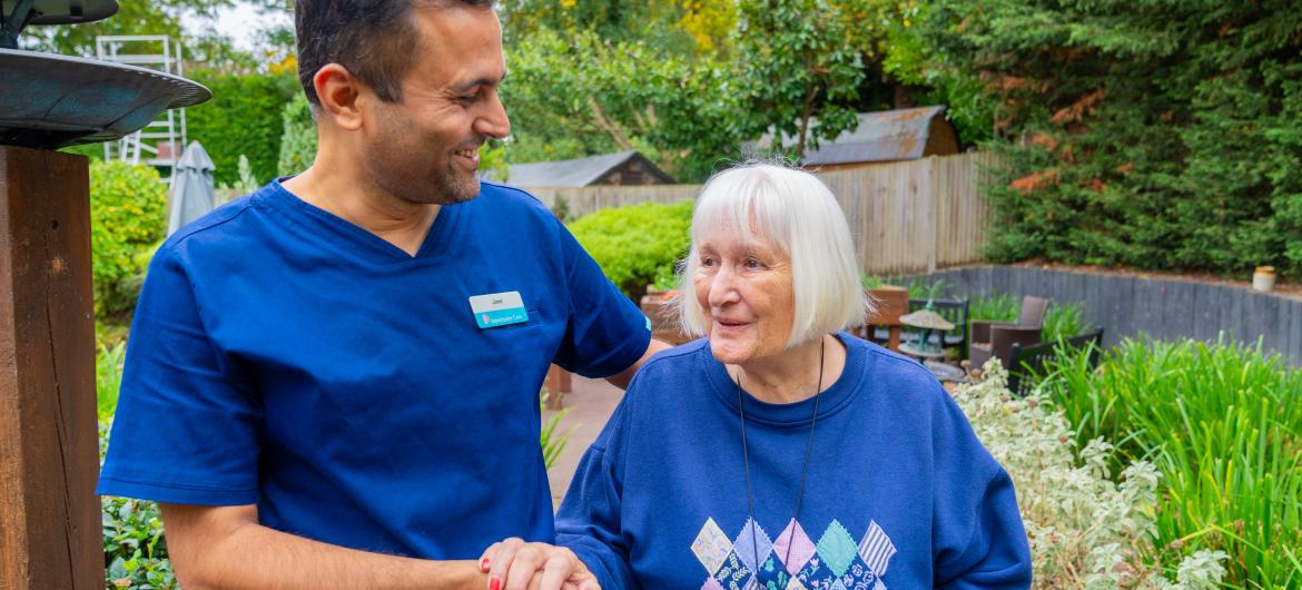 Haven - Resident and Carer walking in garden