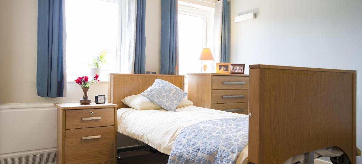 A bright and airy bedroom at Shaftesbury Court Residential Care Home.