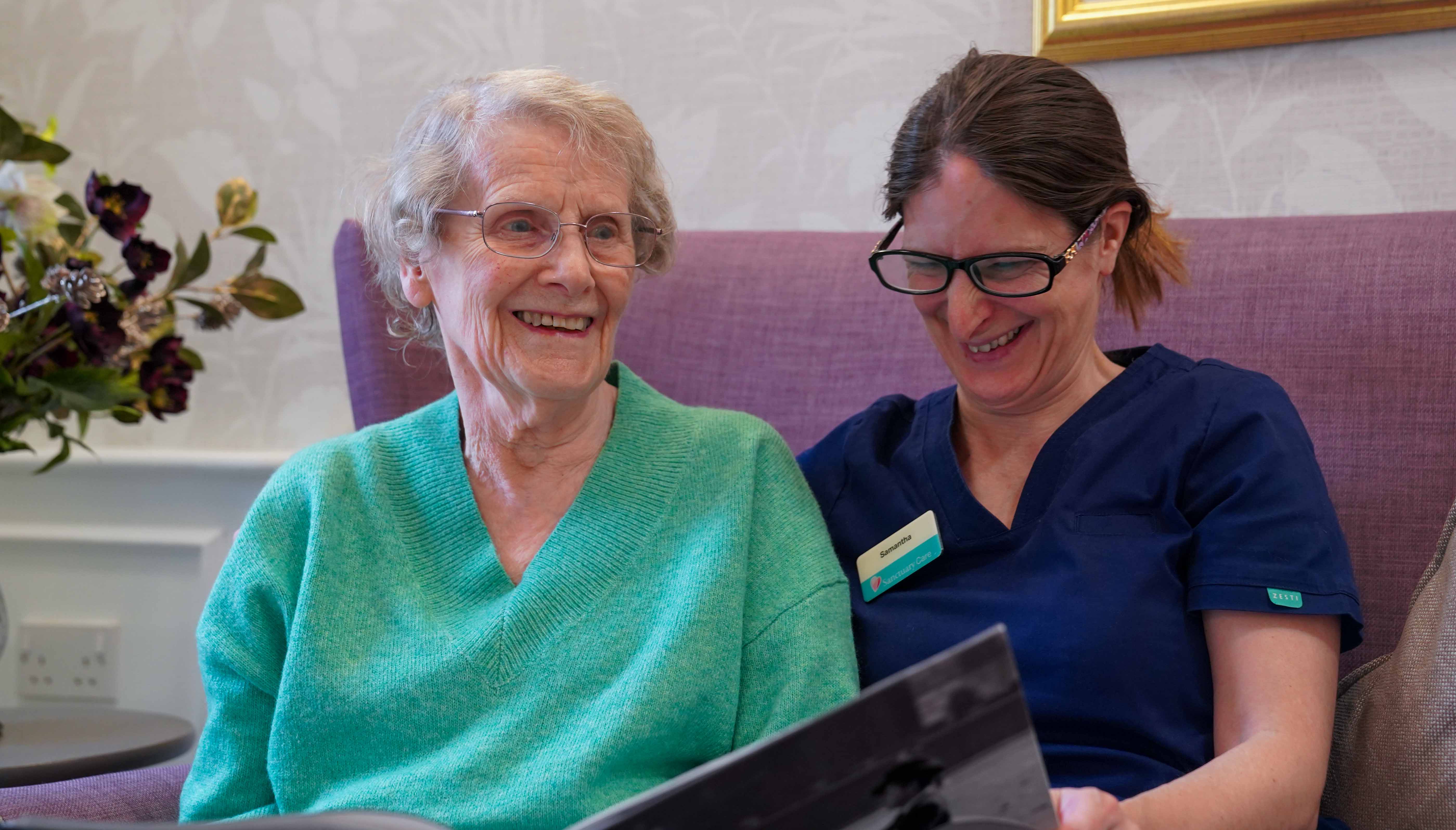 Photo of elderly lady with carer smiling Photo of elderly lady with carer smiling