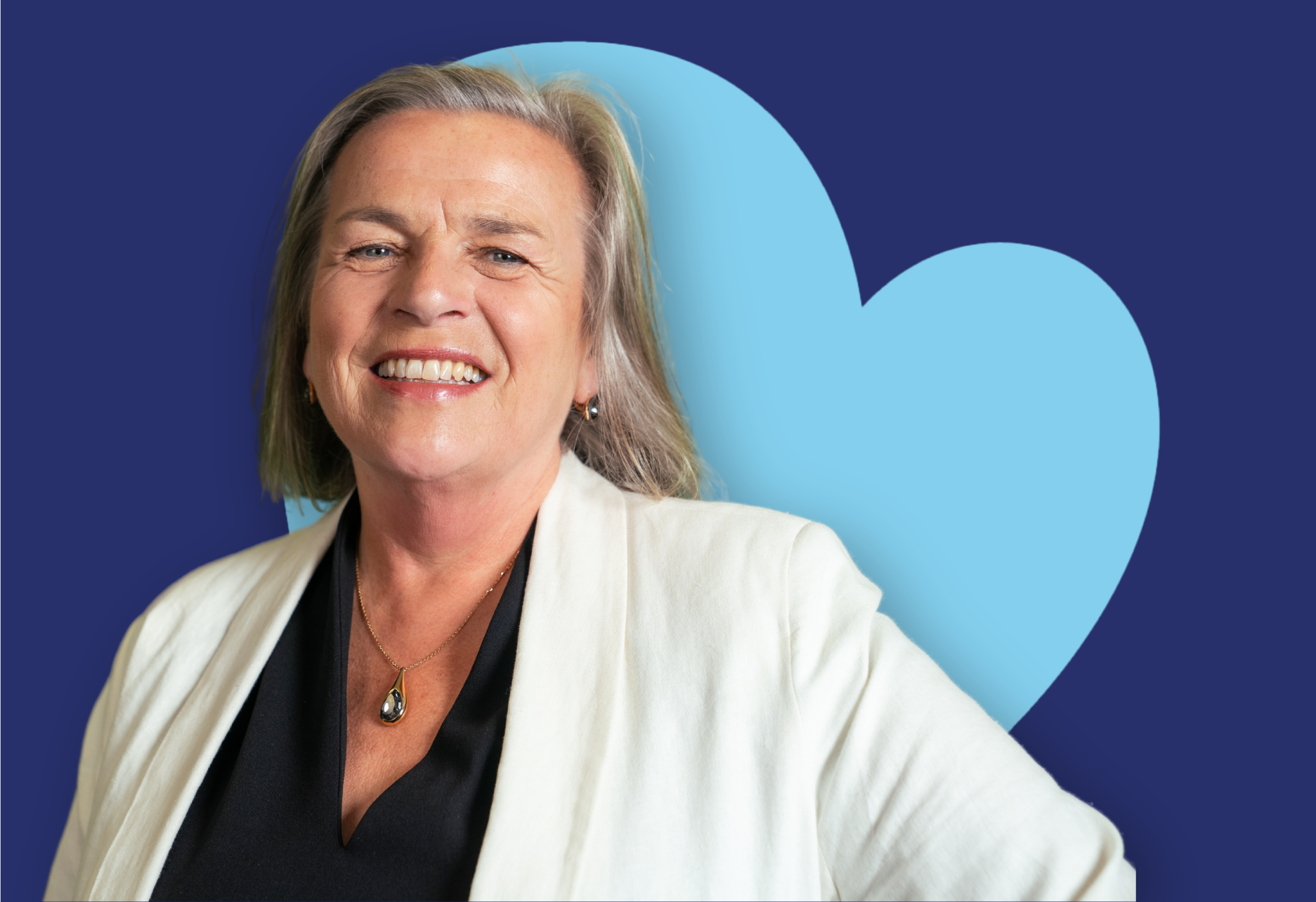 ID28 Jobs management careers - A place where you can lead with confidence A person wearing a light-coloured blazer standing in front of a blue heart-shaped background.