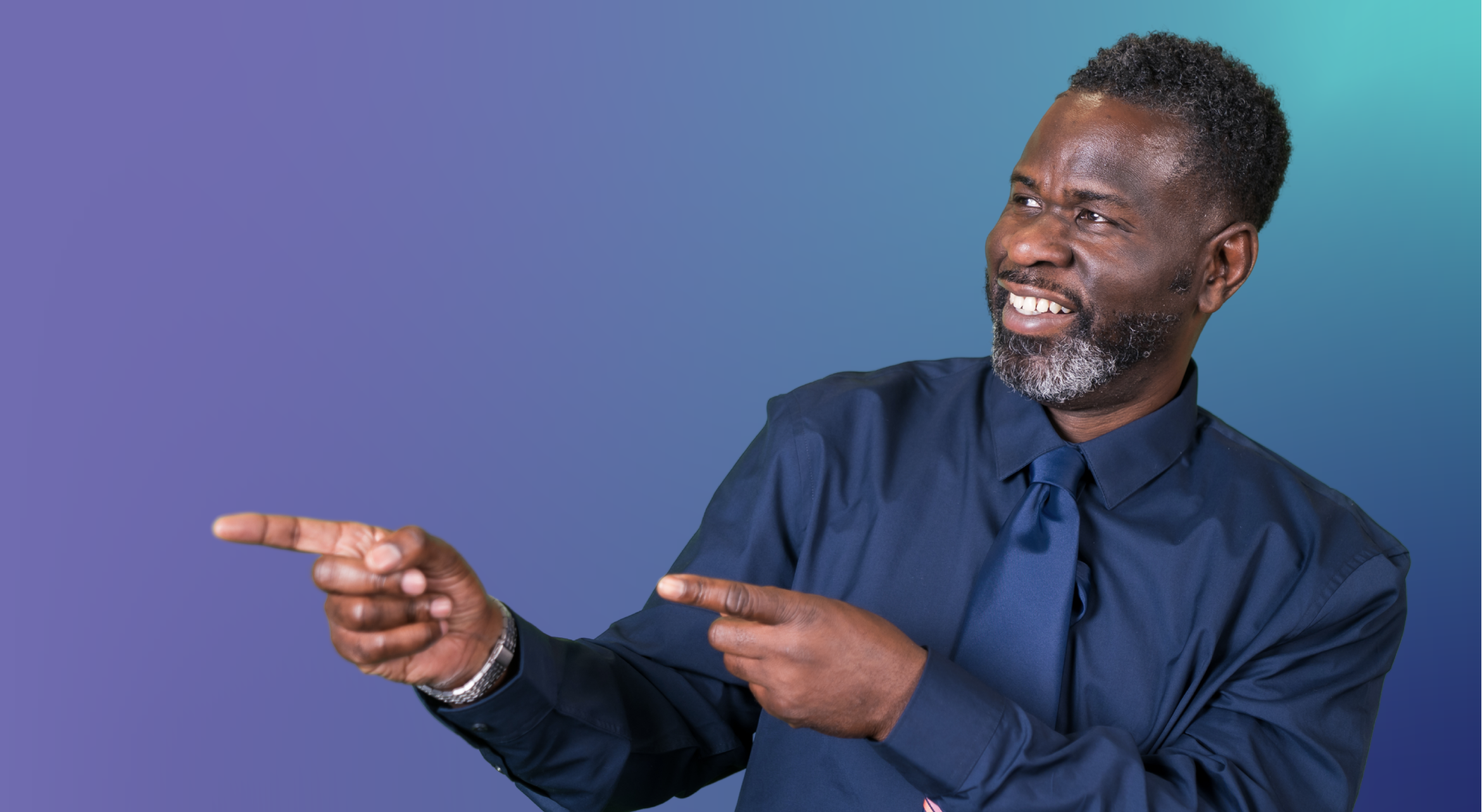 ID29 Jobs management careers - The support behind your leadership A person wearing a dark shirt and tie pointing with both hands against a blue and teal gradient background.