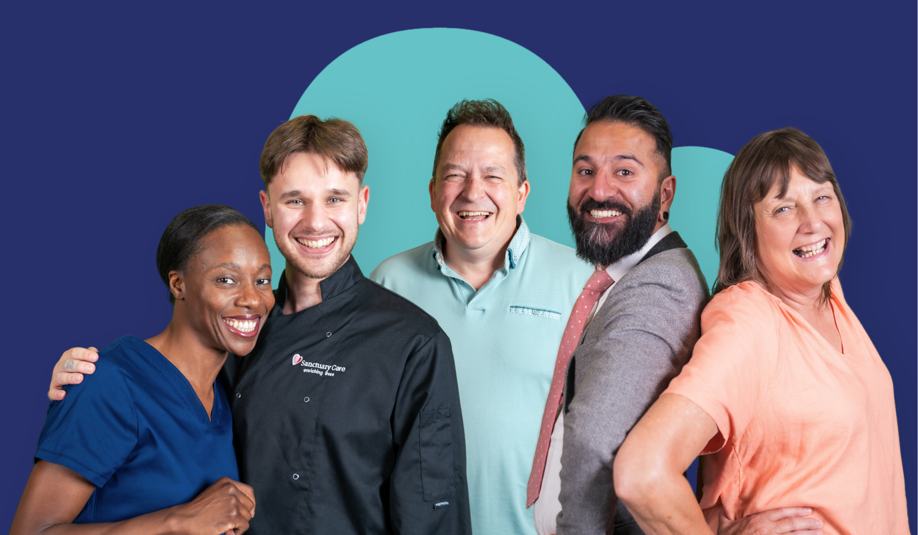 Group of five people standing together and smiling, in front of a large heart shape on a blue background.