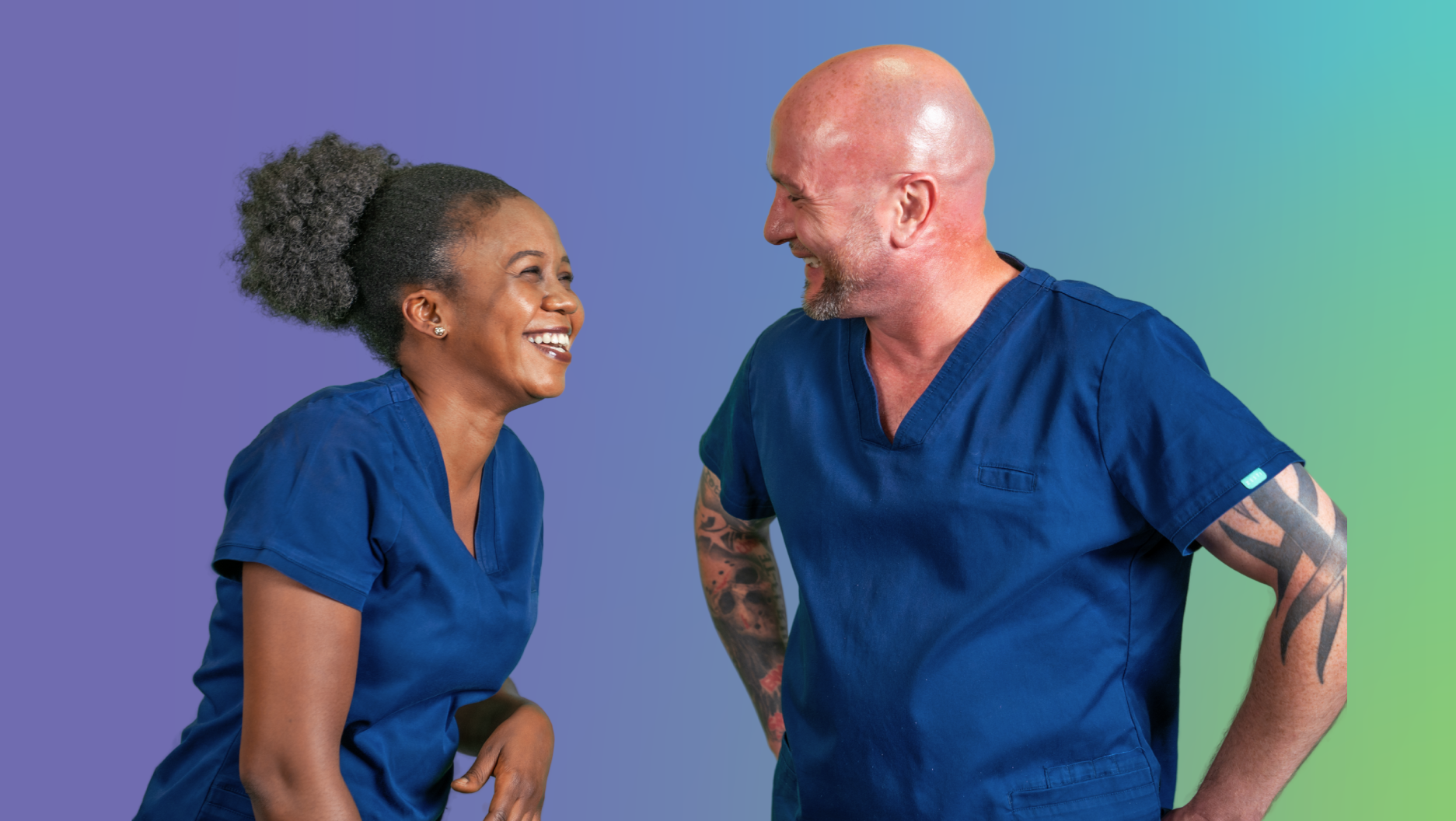 Two people wearing blue healthcare uniforms standing and facing each other against a purple and green gradient background