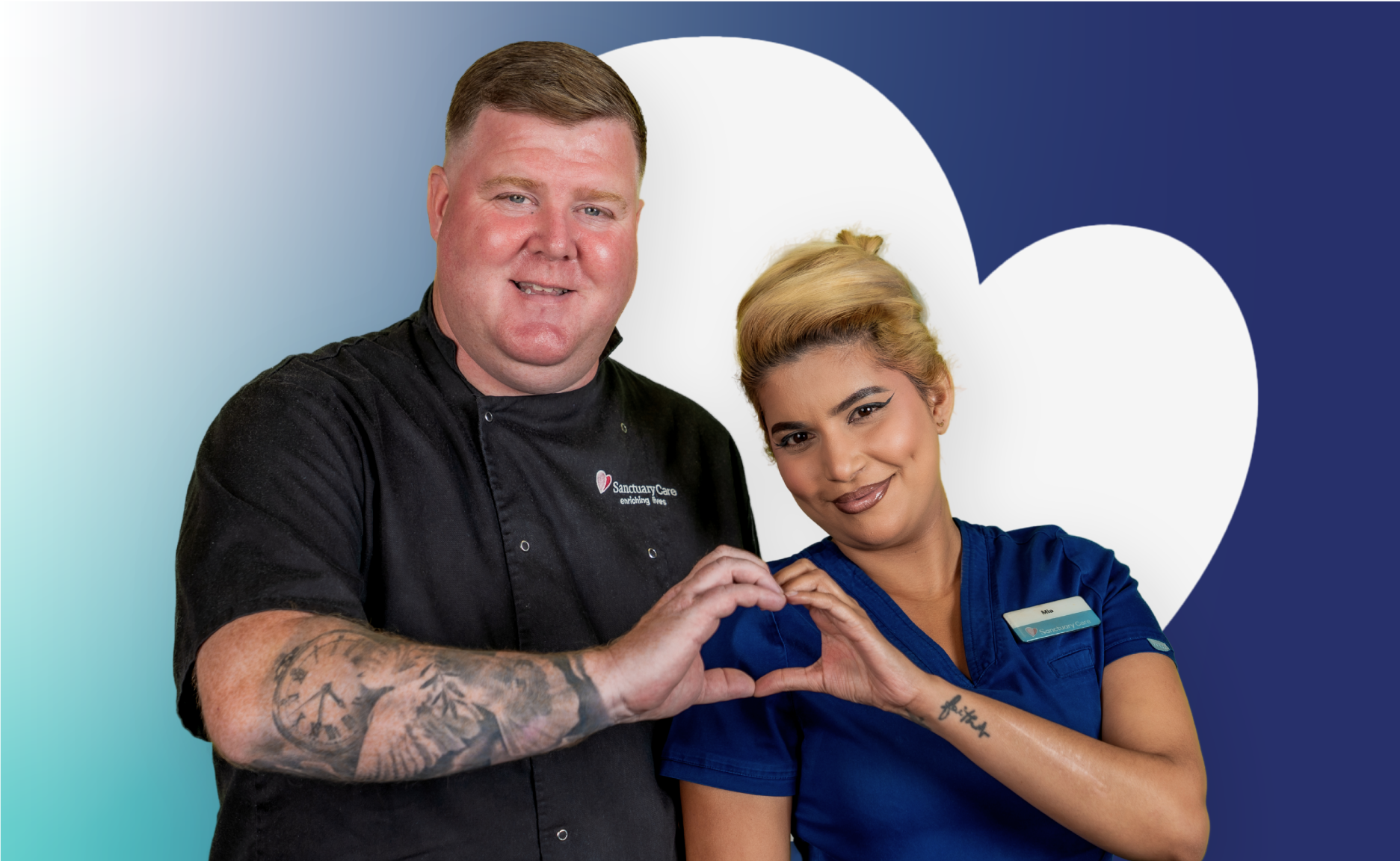 Two people standing side by side and making a heart shape with their hands against a blue background with large white heart shapes