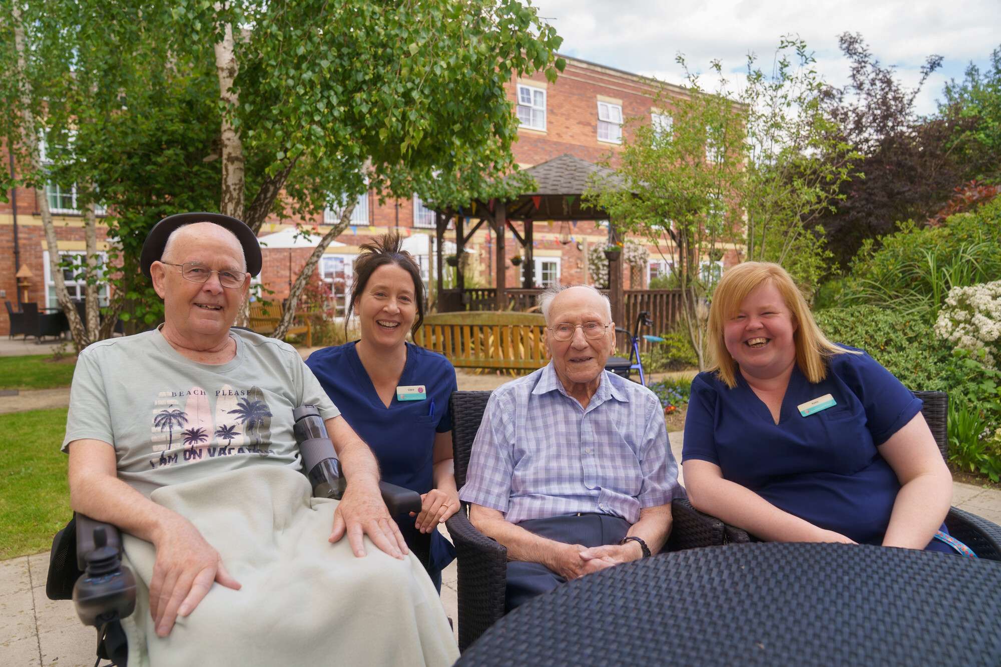 Resident Tony Roberts, staff member Clare Moynihan, Resident Tom (Thomas) Parker and staff member Kirsty Wood