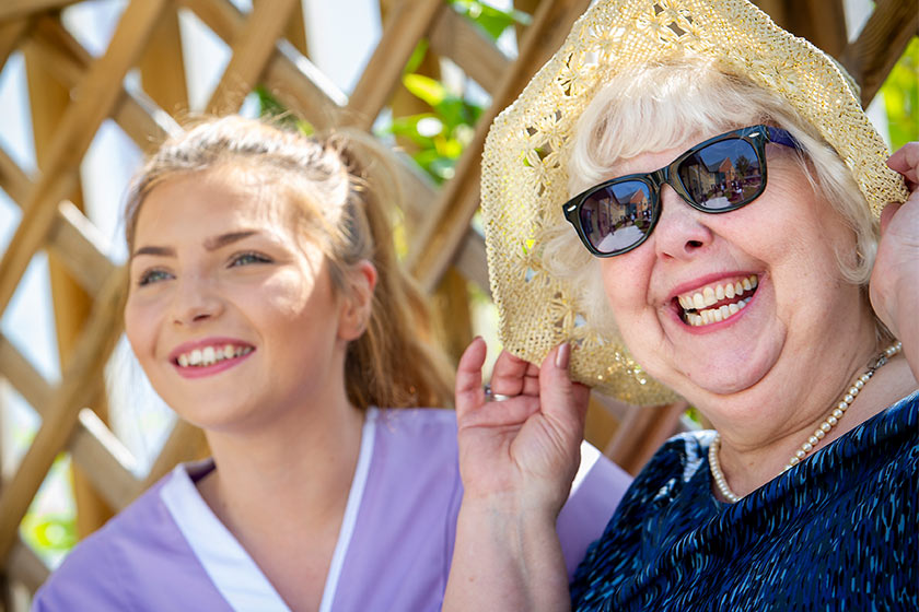 Sanctuary Care assistant and resident smiling