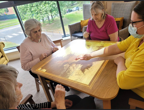 Residents playing with the interactive light games 