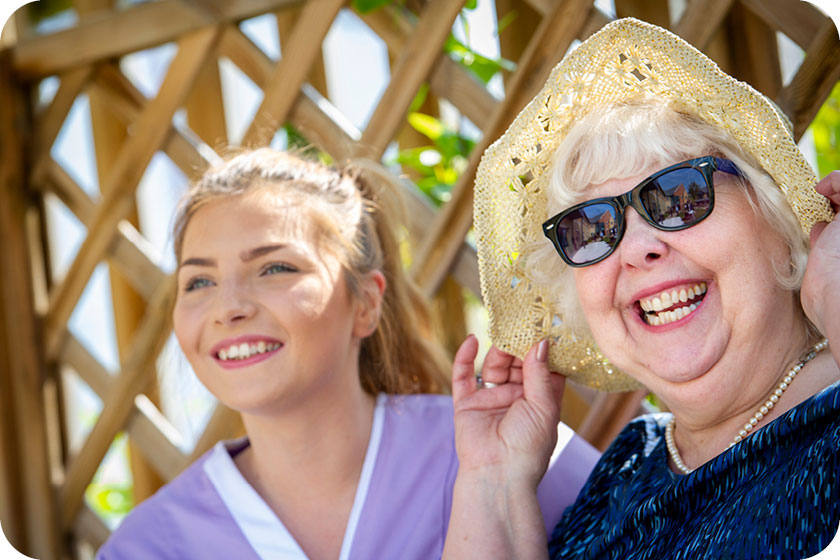 Sanctuary Care assistant and resident smiling