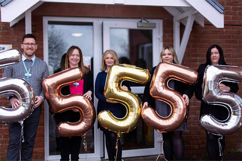 The team at Allanbank Care Home in Dumfries celebrate getting a 'Very Good' Care Inspectorate rating - pictured outside the home with their very good balloons