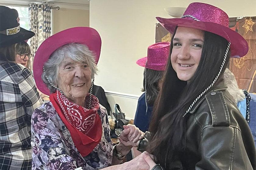 Resident Betty and her granddaughter dressed in their cowboy themed outfits for a wild west celebration at our Chyvarhas home in Cornwall 