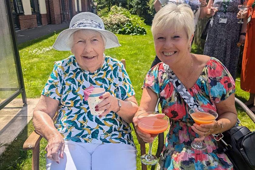 Vivienne and Janet at Barony Lodge Vivienne and Janet sat in a grassed garden area at Barony Lodge with summer drinks