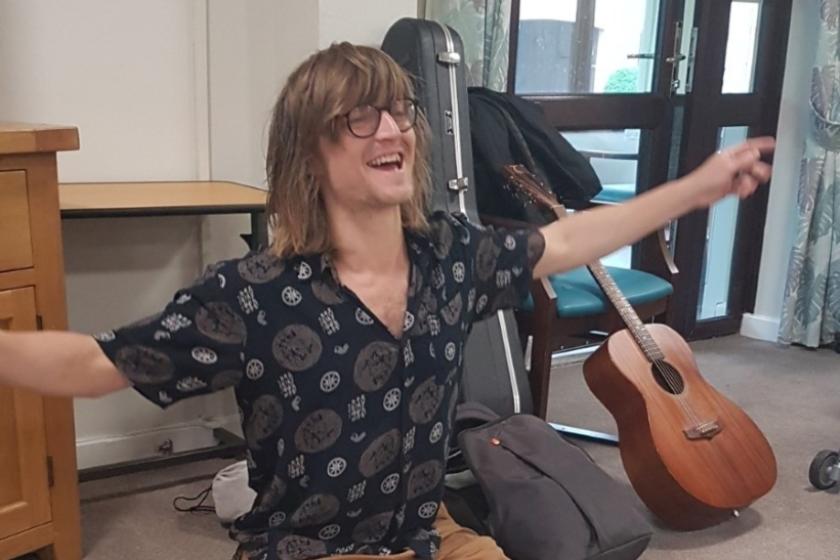 Charlie Law brings music to our care home residents