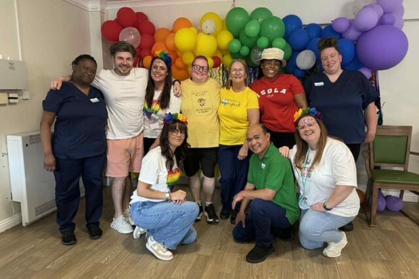 The team at Forefaulds smile wearing their brightest and boldest colours for their Pride celebrations