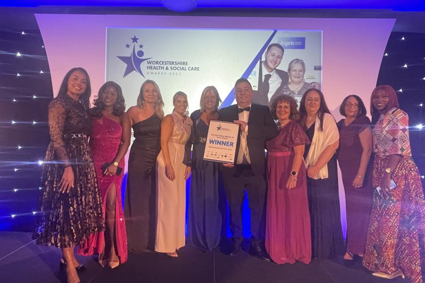 The team from Regent smile for the camera with their award