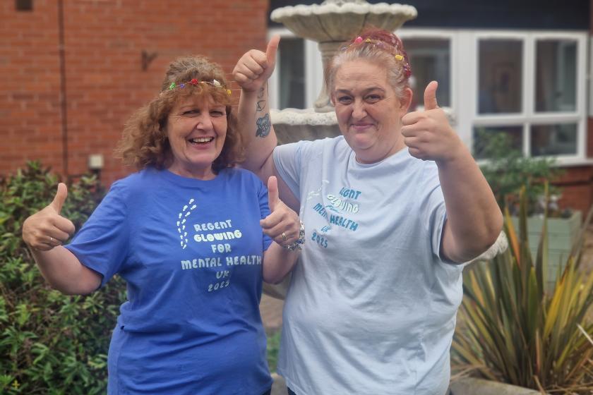 Staff stood together smiling