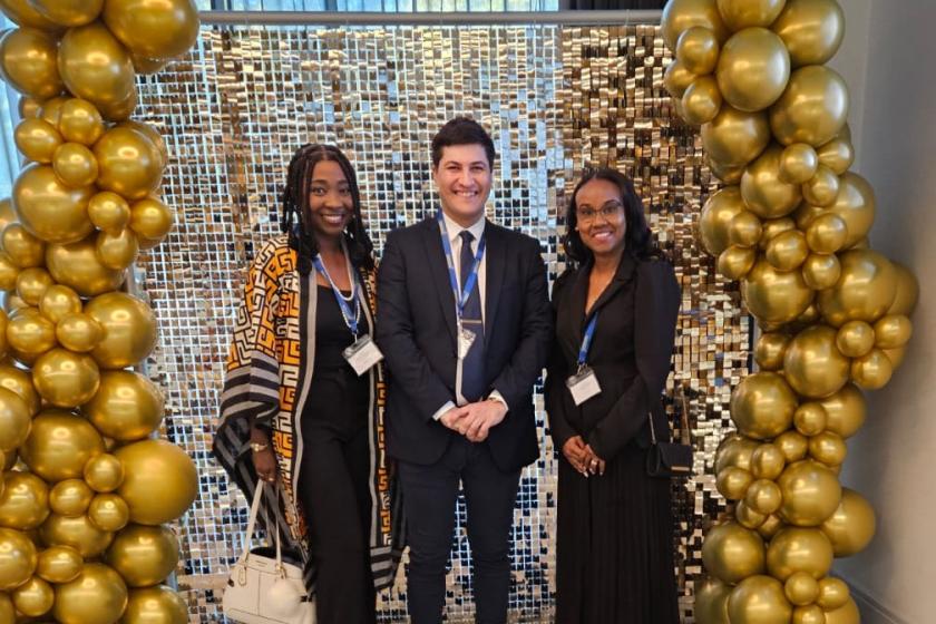 Registered nurse Ayomide, home manager David and nurse manager Okeba smile for the camera on receiving their award