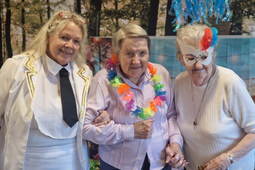 Staff and residents stood together smiling