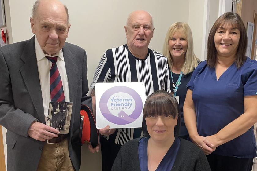 Staff and residents stood together smiling