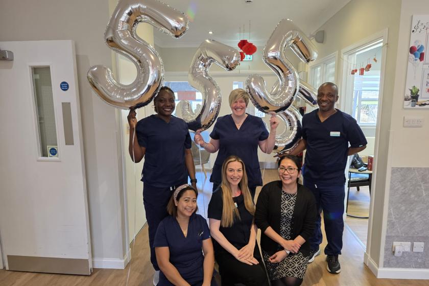 Staff stood together smiling