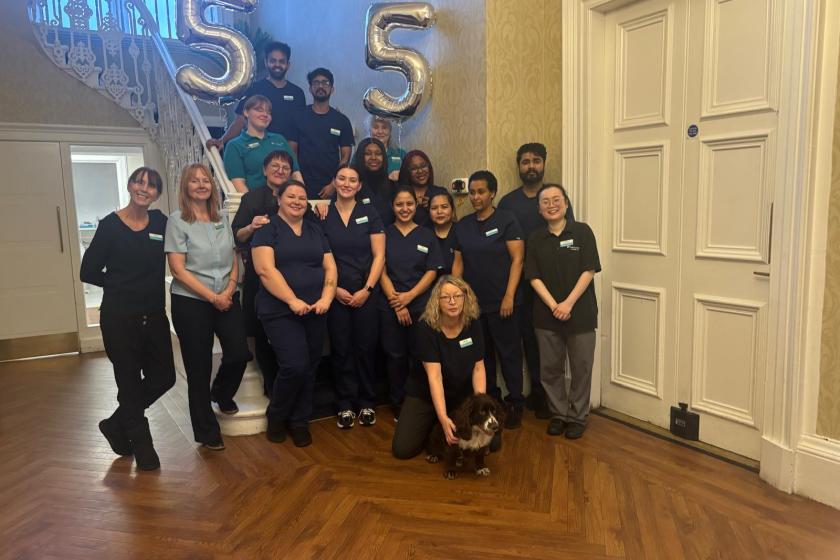 Staff stood together smiling