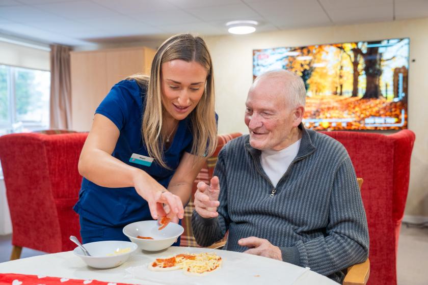 Staff and resident smiling