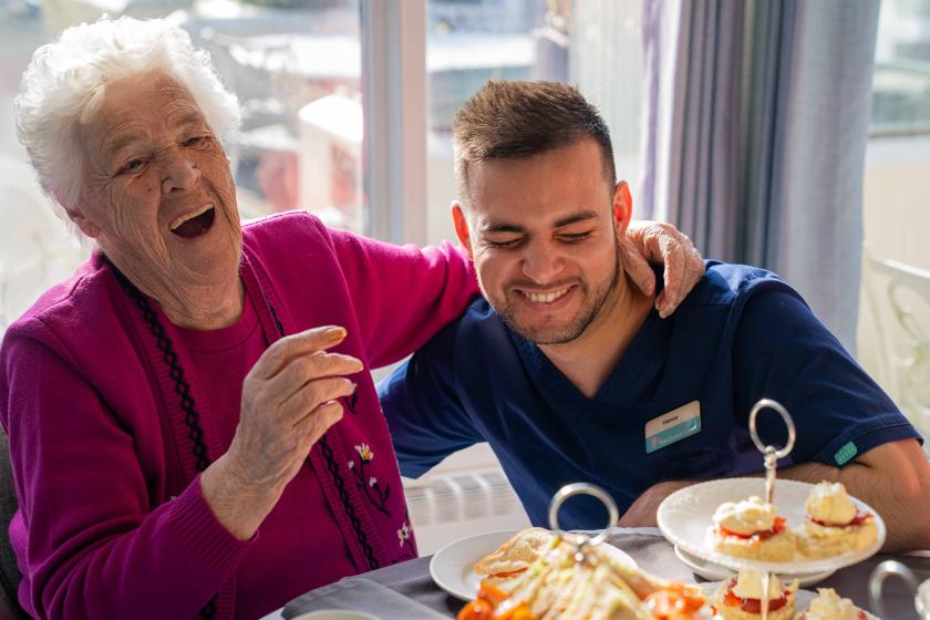 Resident and Staff laughing