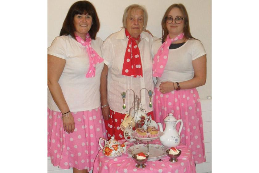 Staff and a resident from Furzehatt dressed in vintage 1950s clothes.