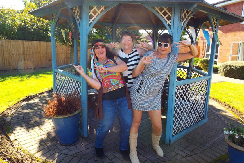 Regent staff dressed up in swinging sixties fancy dress