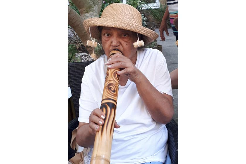 A Rowanweald resident playing a didgeridoo