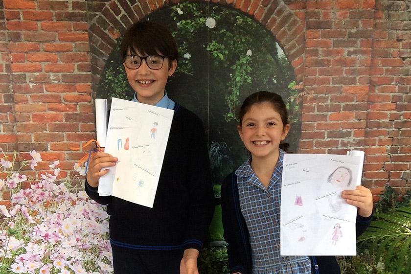 Arthur and and Carina showing off their artwork