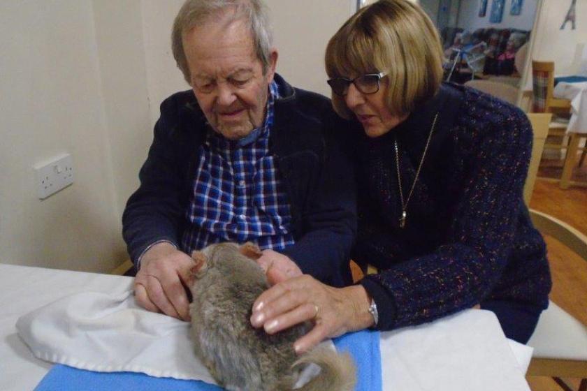 Resident Brian Goodson and his relative Mauricette Goodson with a friendly chinchilla.