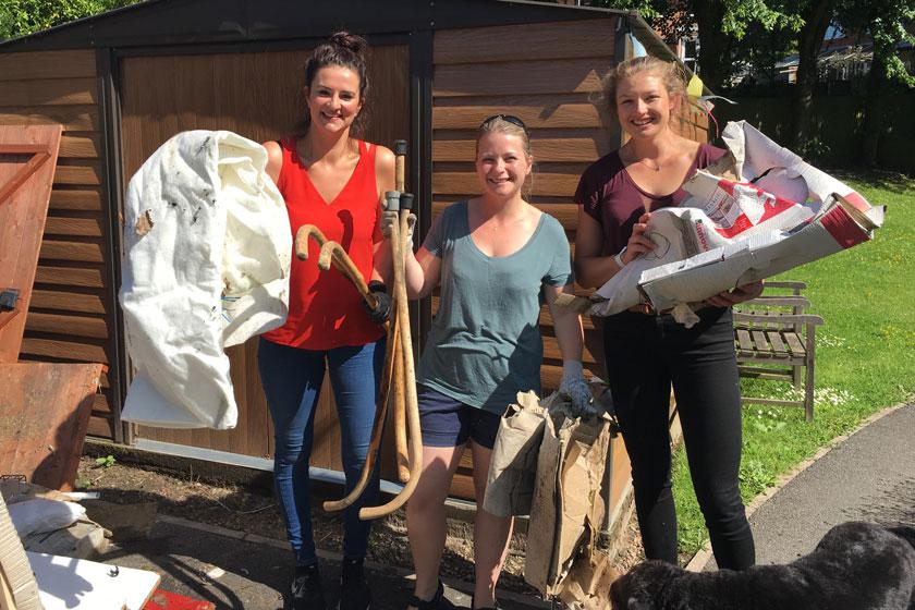The Sanctuary Care staff volunteering to help transform a garden space.