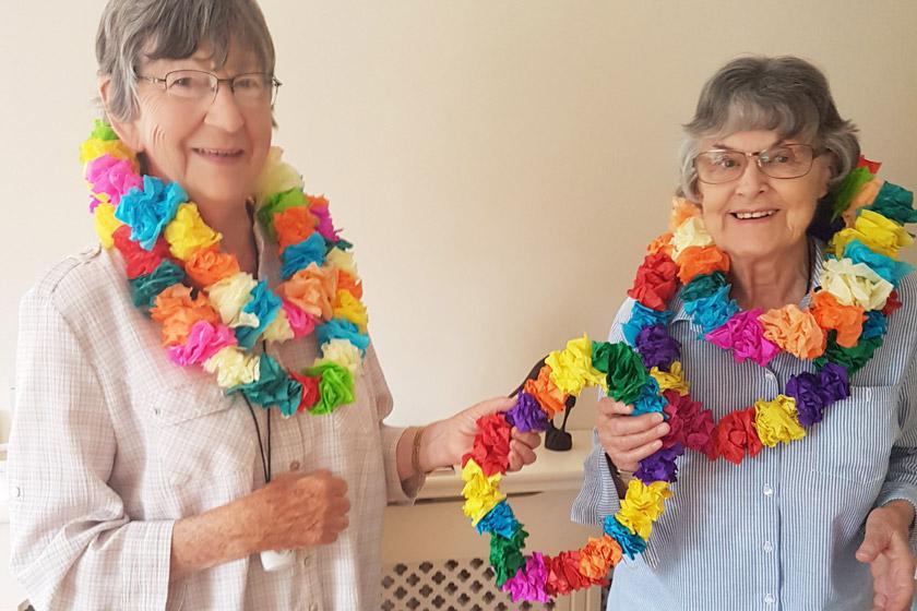 Residents wearing handmade Hawaiian garlands.