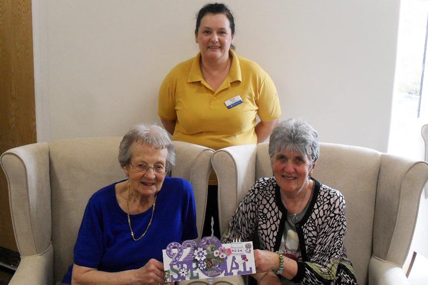 Resident Bryony Corby, activities leader Suzie Davis and visitor Vera Price