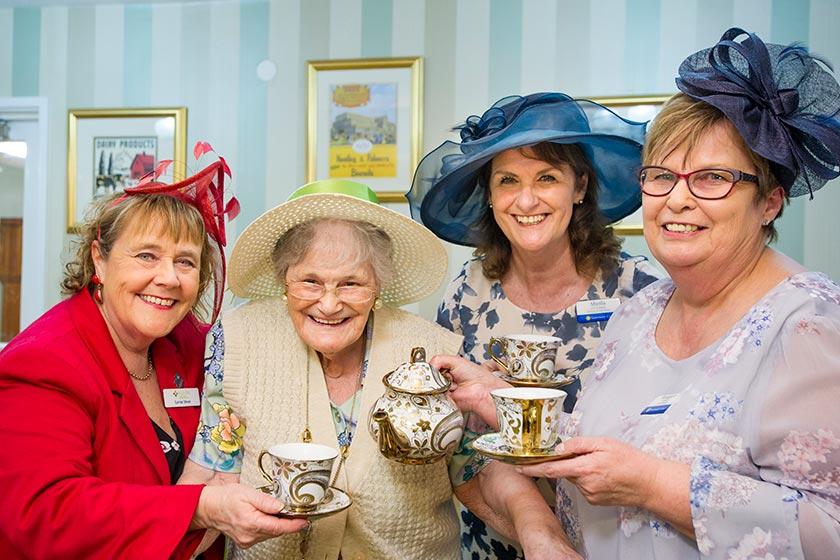Staff and residents at Ashley House celebrate the 20 year anniversary.