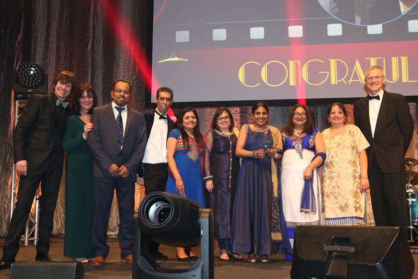 The Asra House care home team with their award and Jeremy Vine.