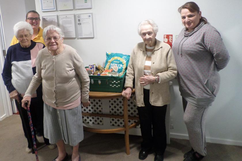Staff and residents with their donations for Harwich Foodbank.