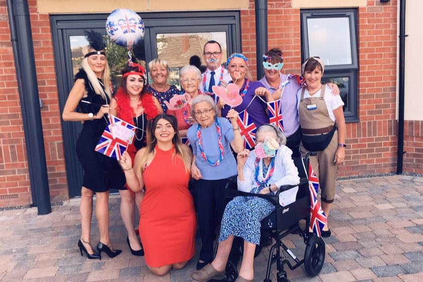 Staff and residents at Ridgewood Court celebrating their summer cruise event.
