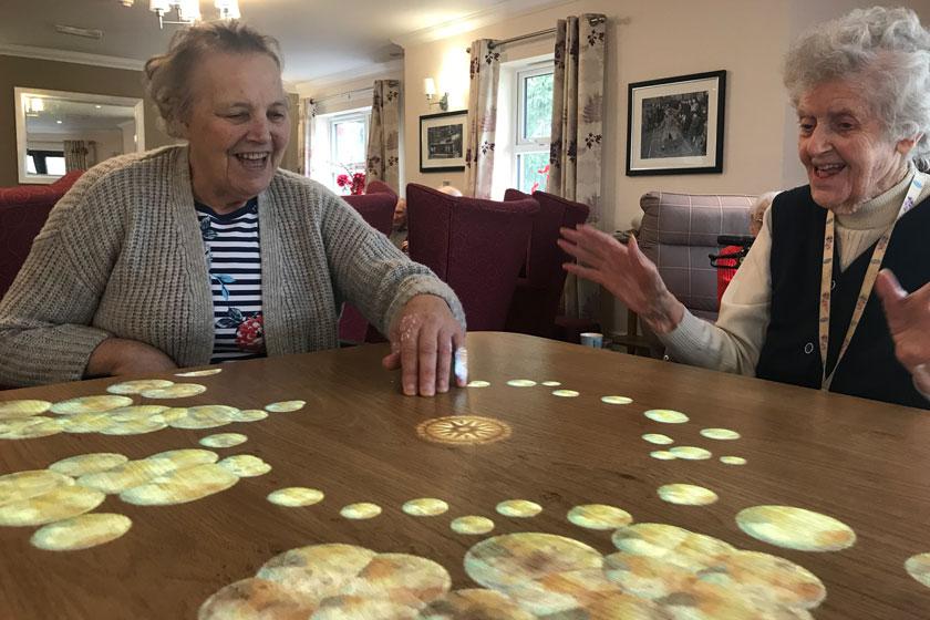 Residents using the new 'Magic Table'