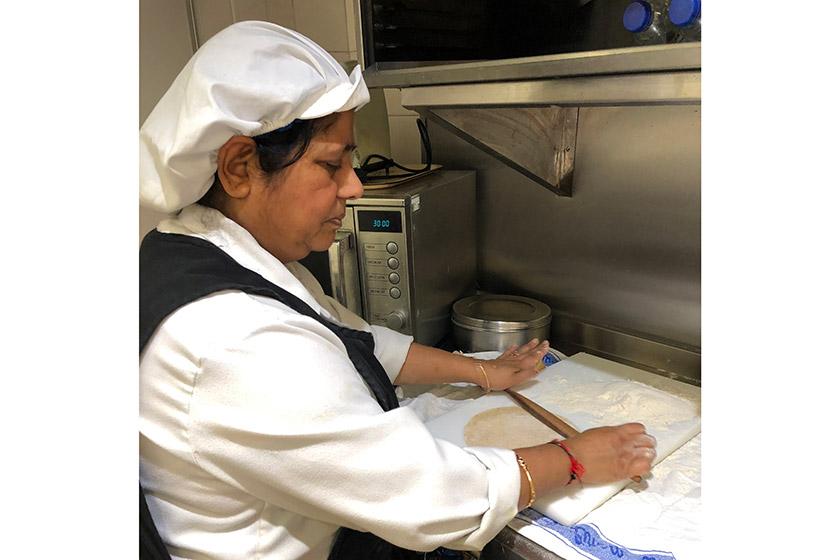 Hansa Bagtharia, chef at Asra House Residential Care Home, preparing chapattis. Hansa Bagtharia prepares chapattis