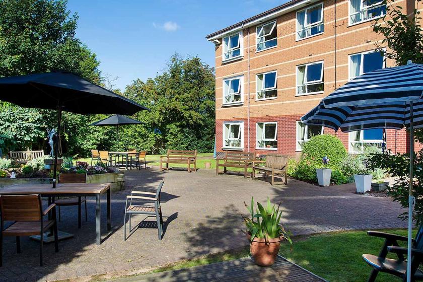 Breme care home exterior with a well-maintained garden area.
