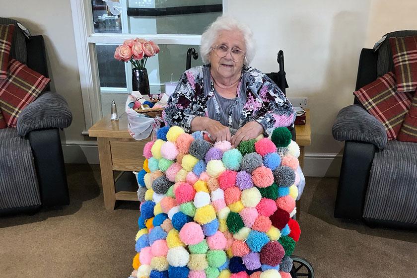 Brenda's bright and beautiful blanket Brenda Moroz with her blanket at Highcroft Hall Residential Care Home in Wolverhampton