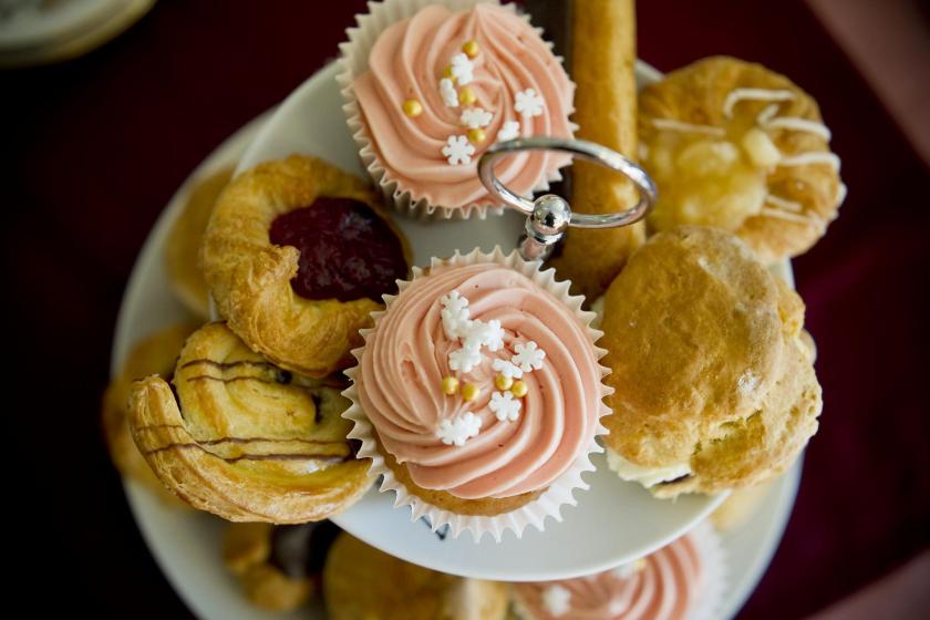 A cake stand full of delicious home-made cakes.