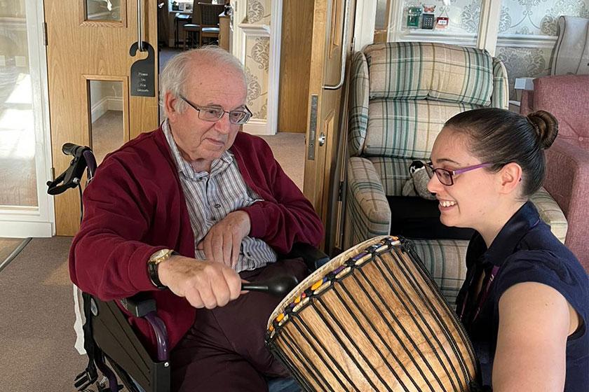Ivor, resident at Upton Dene Residential and Nursing Home, our care home in Chester, with music therapy student Hannah 
