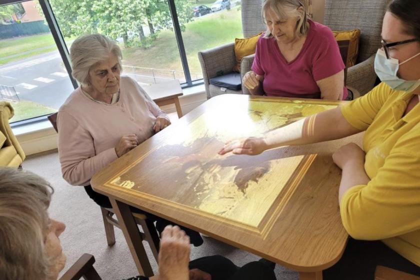 Residents playing with the interactive light games 