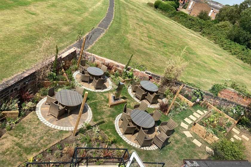 An aerial view of the garden space with patio furniture