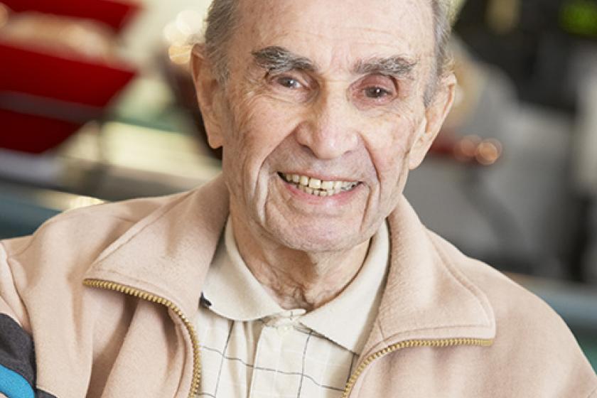 Senior man smiling as he drinks a cup of coffee Senior man smiling as he drinks a cup of coffee