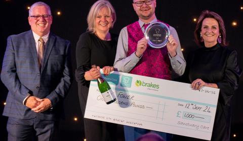Winner of Masterchef 2024 Joe Fower with his prize at Sanctuary Care's Chef Conference