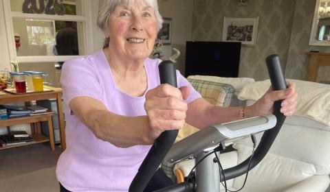 Briggs Lodge resident Mavis cycling on an exercise bike.